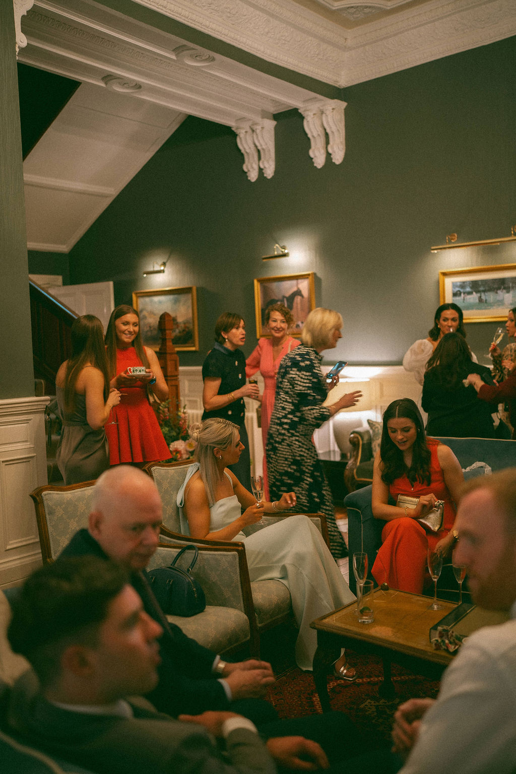 Guests socialise in the drawing room